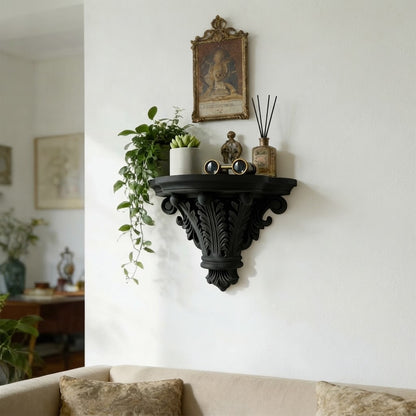 Black ornate carved corbel floating shelf with leaf pattern and round lip
