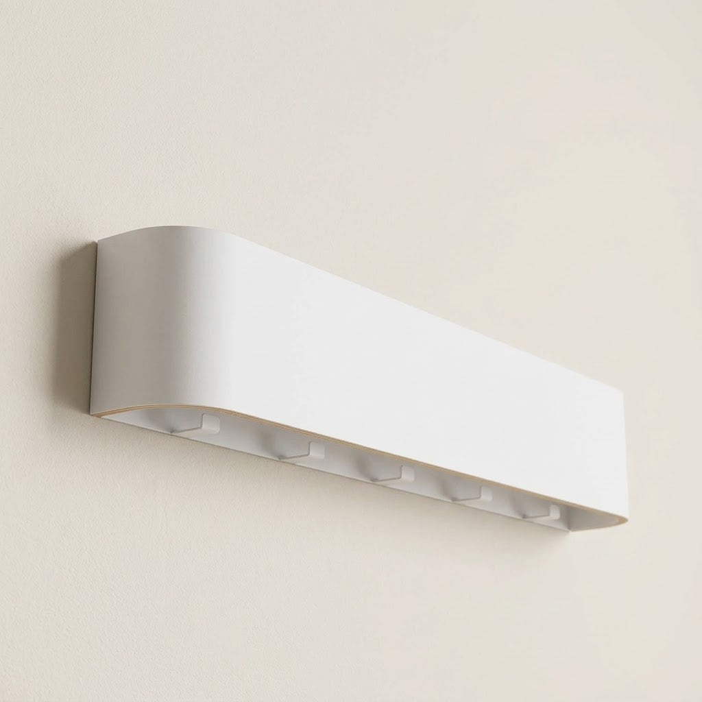 Wall-mounted concealed hook rail with white wood front and hidden hook slots