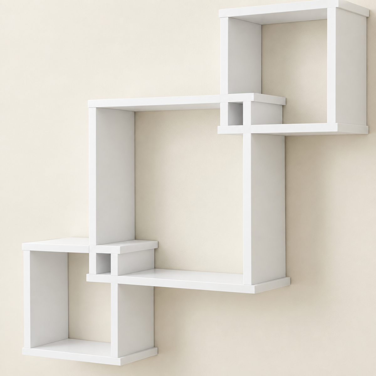 White wall-mounted cube shelf set with three staggered open cubbies