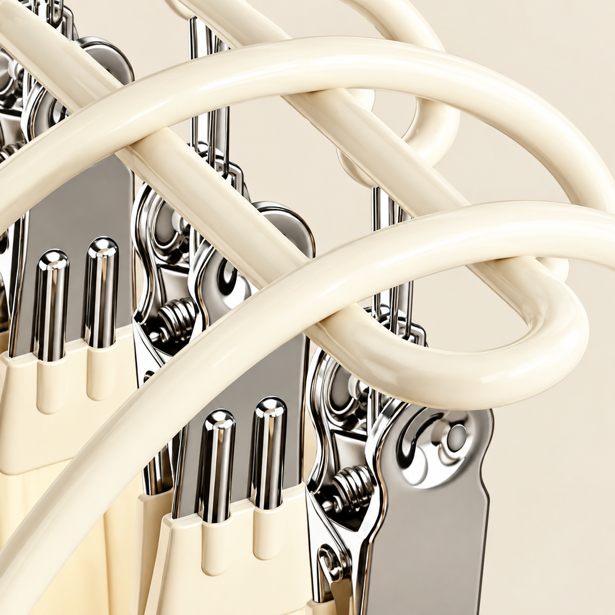 Cream multi-peg hanger with curved bars and lined pegs
