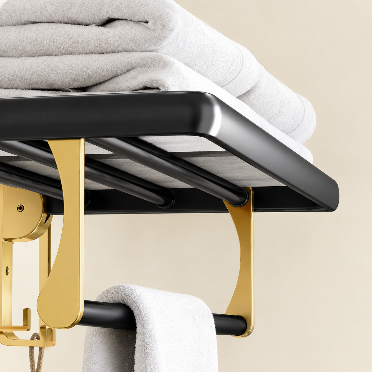 Wall-mounted towel rack detail with black shelf, gold supports, towels on rails