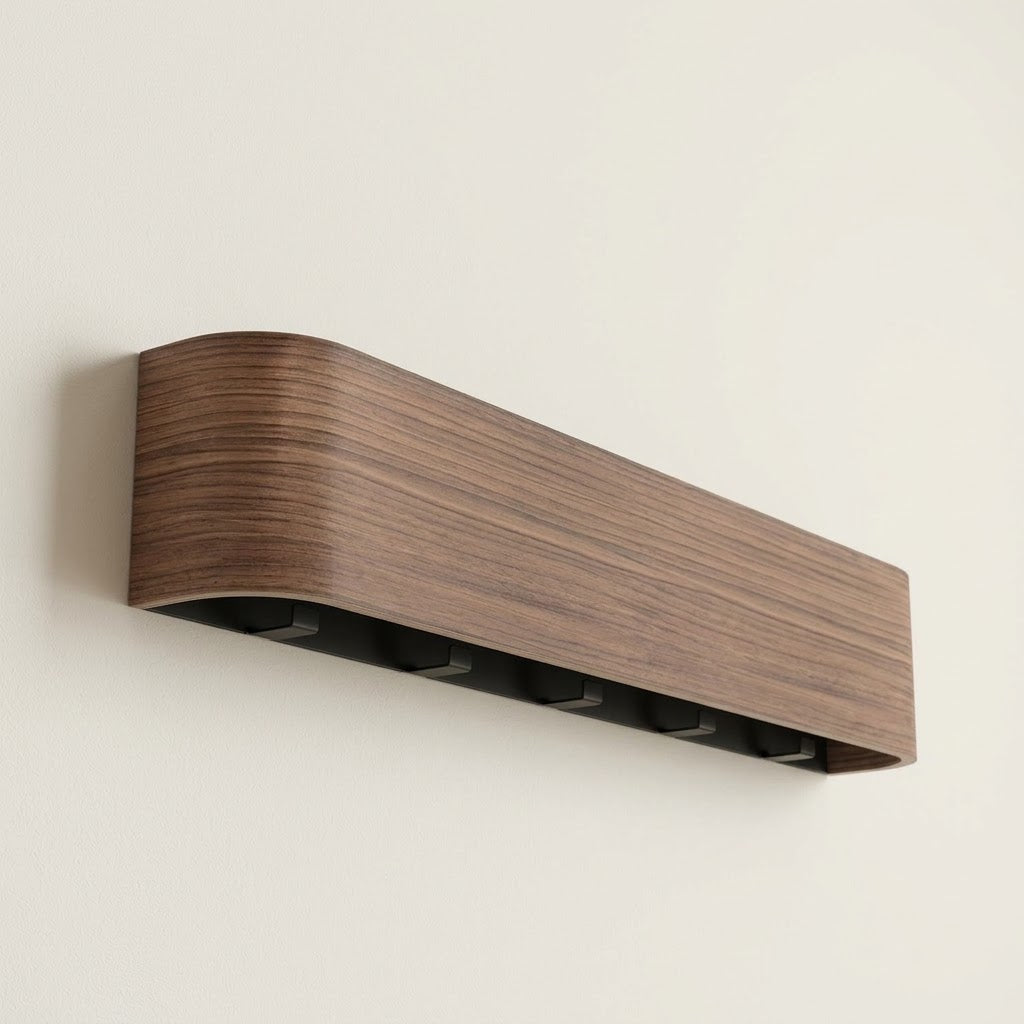 Wall-mounted concealed hook rail with walnut wood front and hidden black hook slots