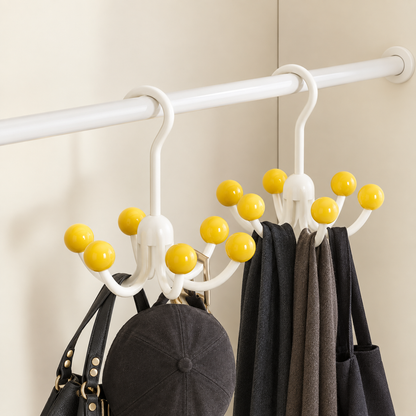 White rotating hanger with yellow ball hooks for accessories