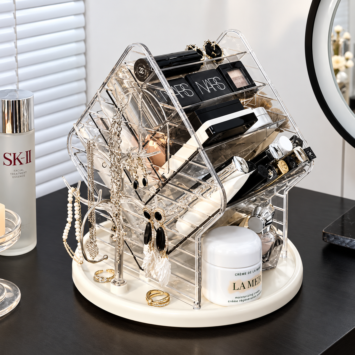 Clear rotating hexagon jewelry organizer stand with compartments and necklace hooks