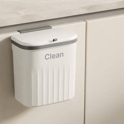 White two-way hanging cupboard door bin with lid closed and “Clean” label on front