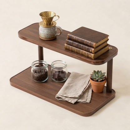 Two-tier bamboo countertop rack with open shelves for jars, books, and decor