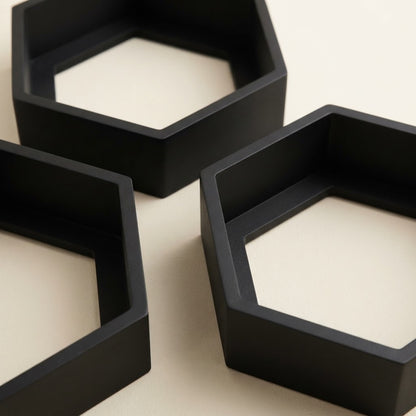 Black hexagon floating wall shelf set, three open hexagon compartments