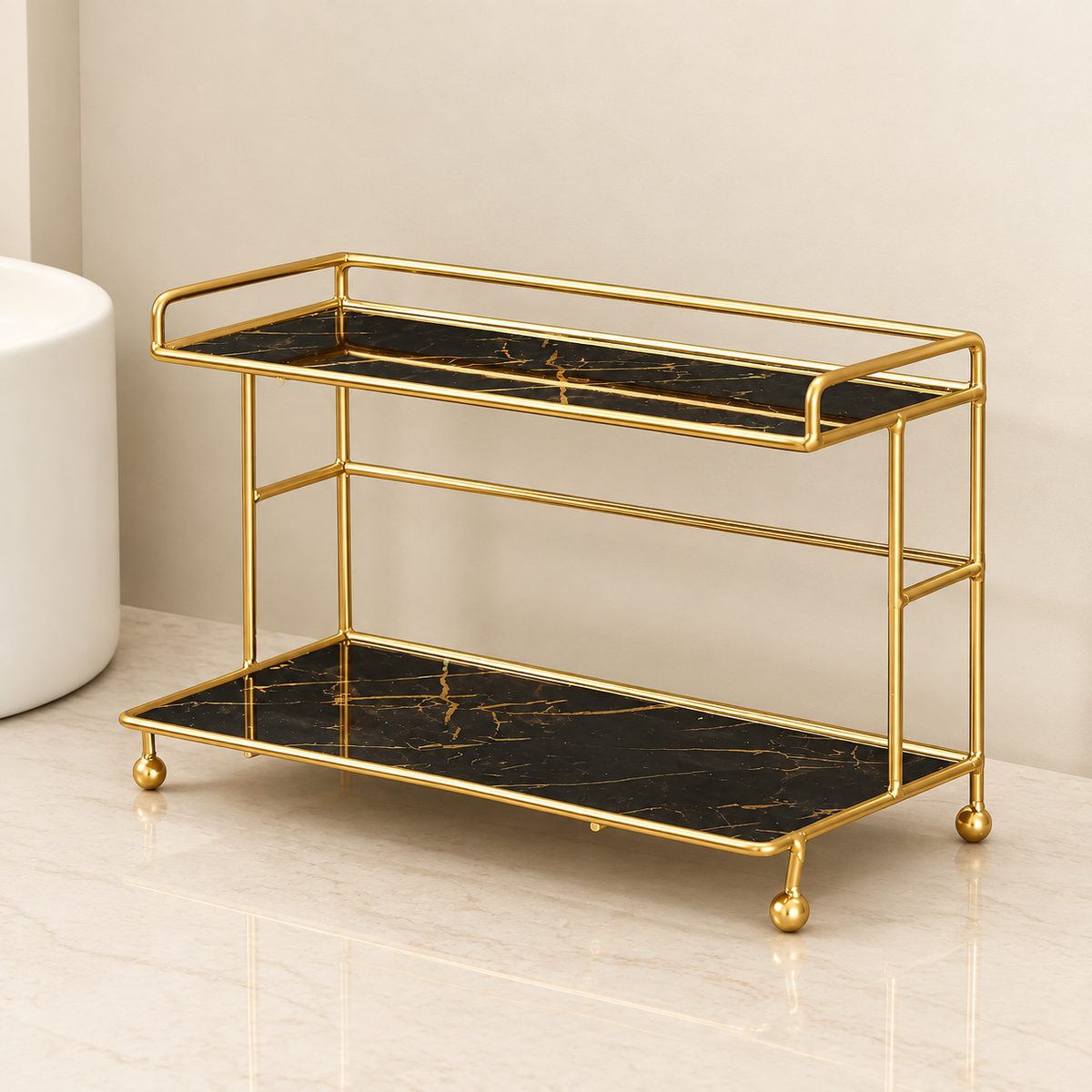 2-tier bathroom countertop organizer with gold guardrails and black marble-look trays