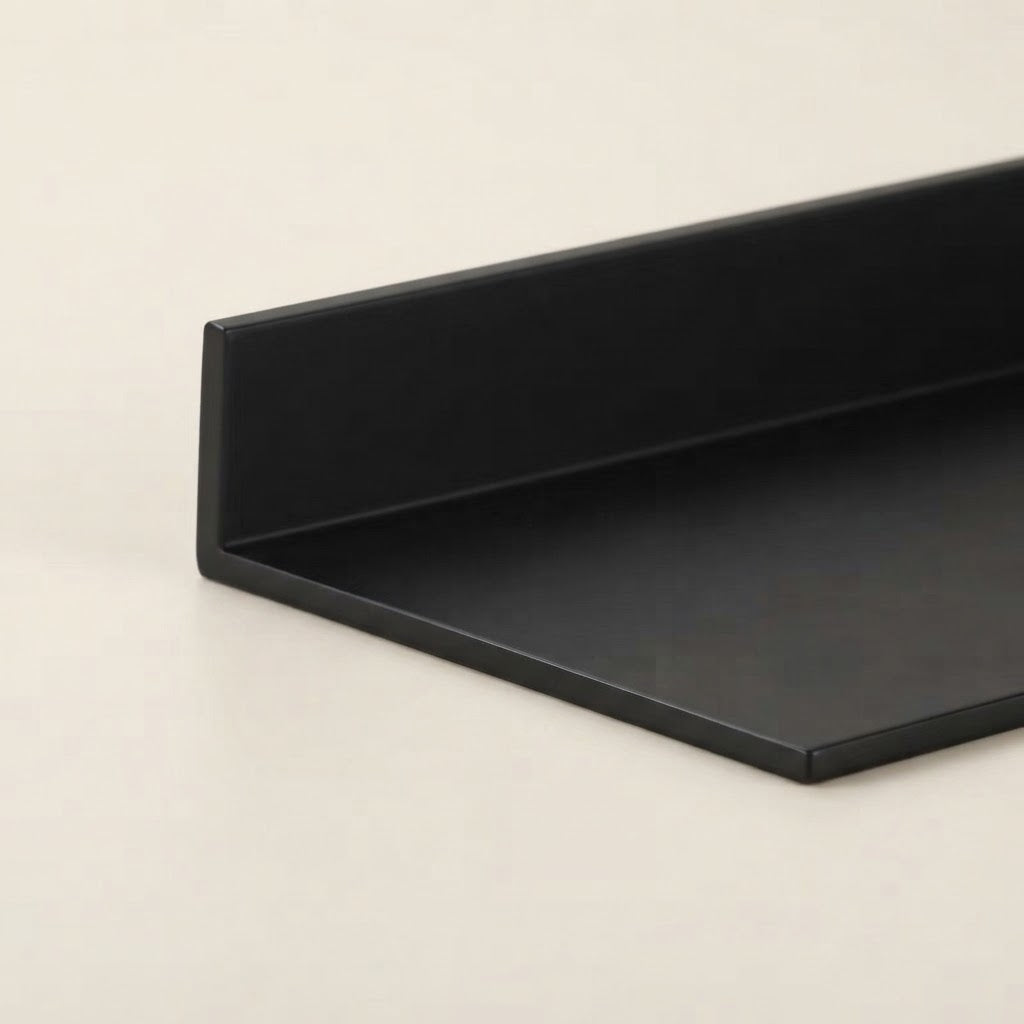Black floating shelf underside with smooth edge and recessed mounting channel.