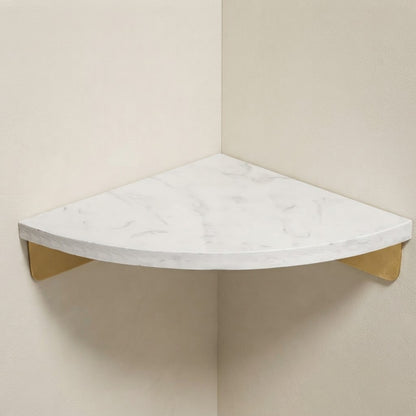 White marble corner floating shelf with gold triangular supports, smooth rounded edge