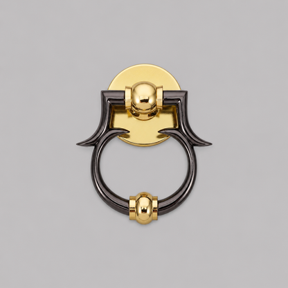 Brass and dark metal ring door knocker with circular plate and curved grips