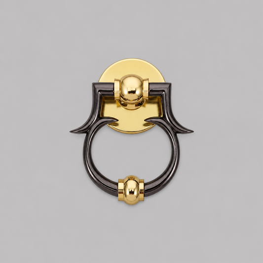 Brass and dark metal ring door knocker with circular plate and curved grips