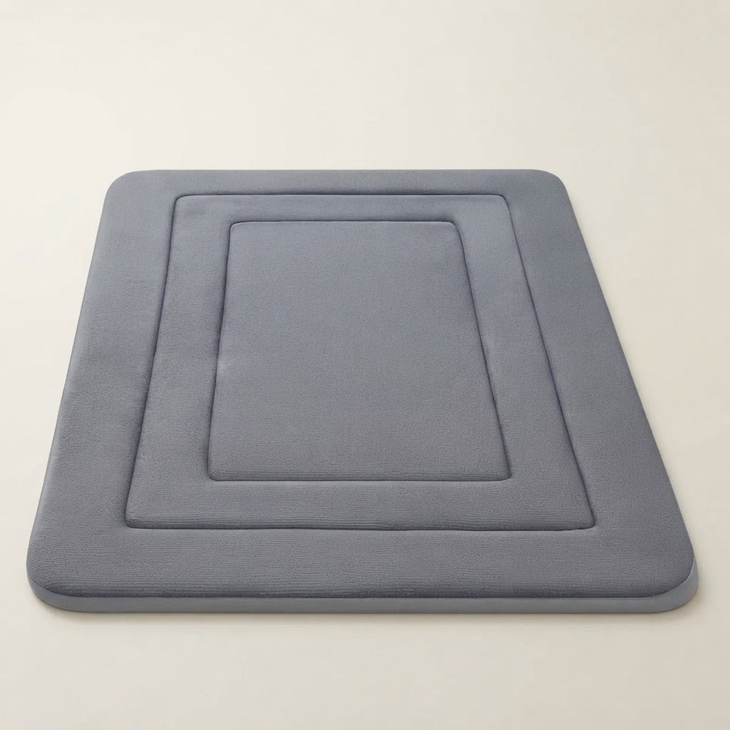 Grey soft cushioned non-slip bath mat with recessed square design
