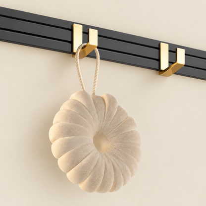 Wall-mounted towel rack end hook with gold holder on black bar