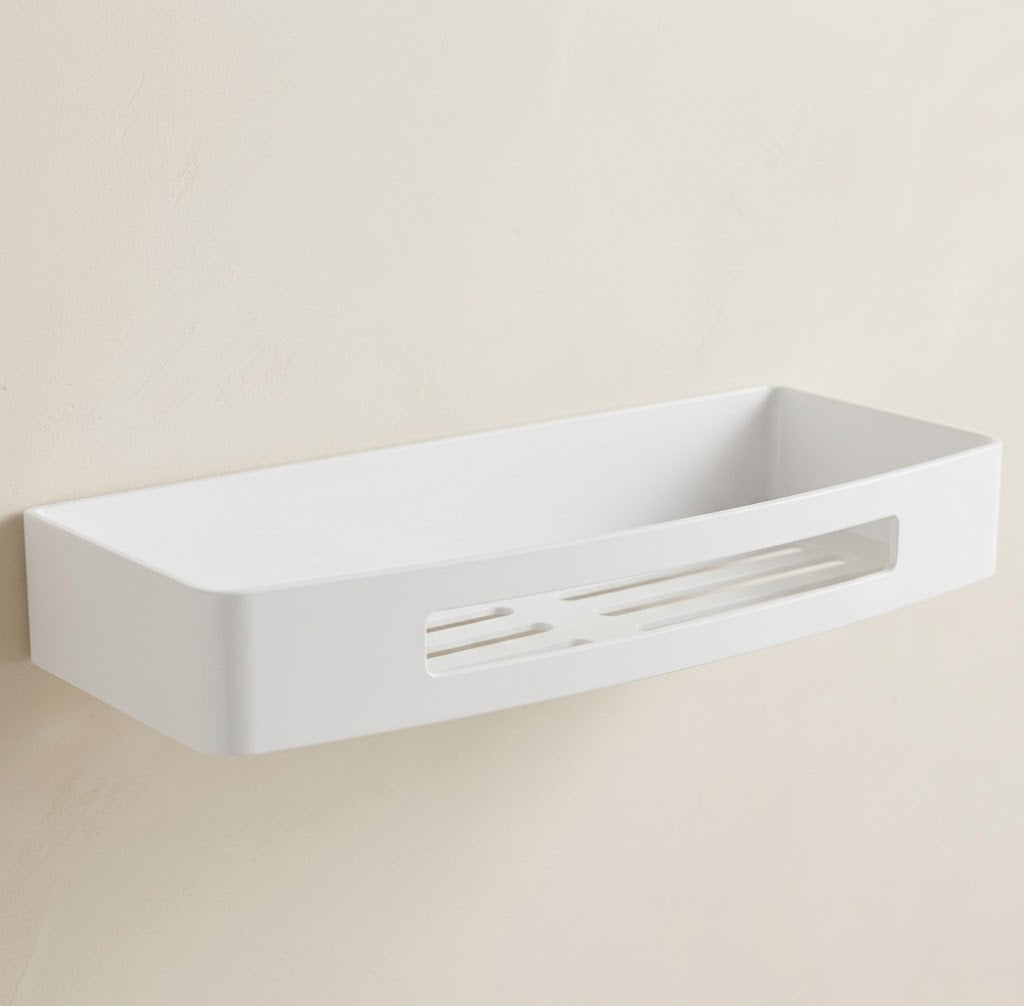White stainless steel wall shower caddy tray with drainage slots, single tier.