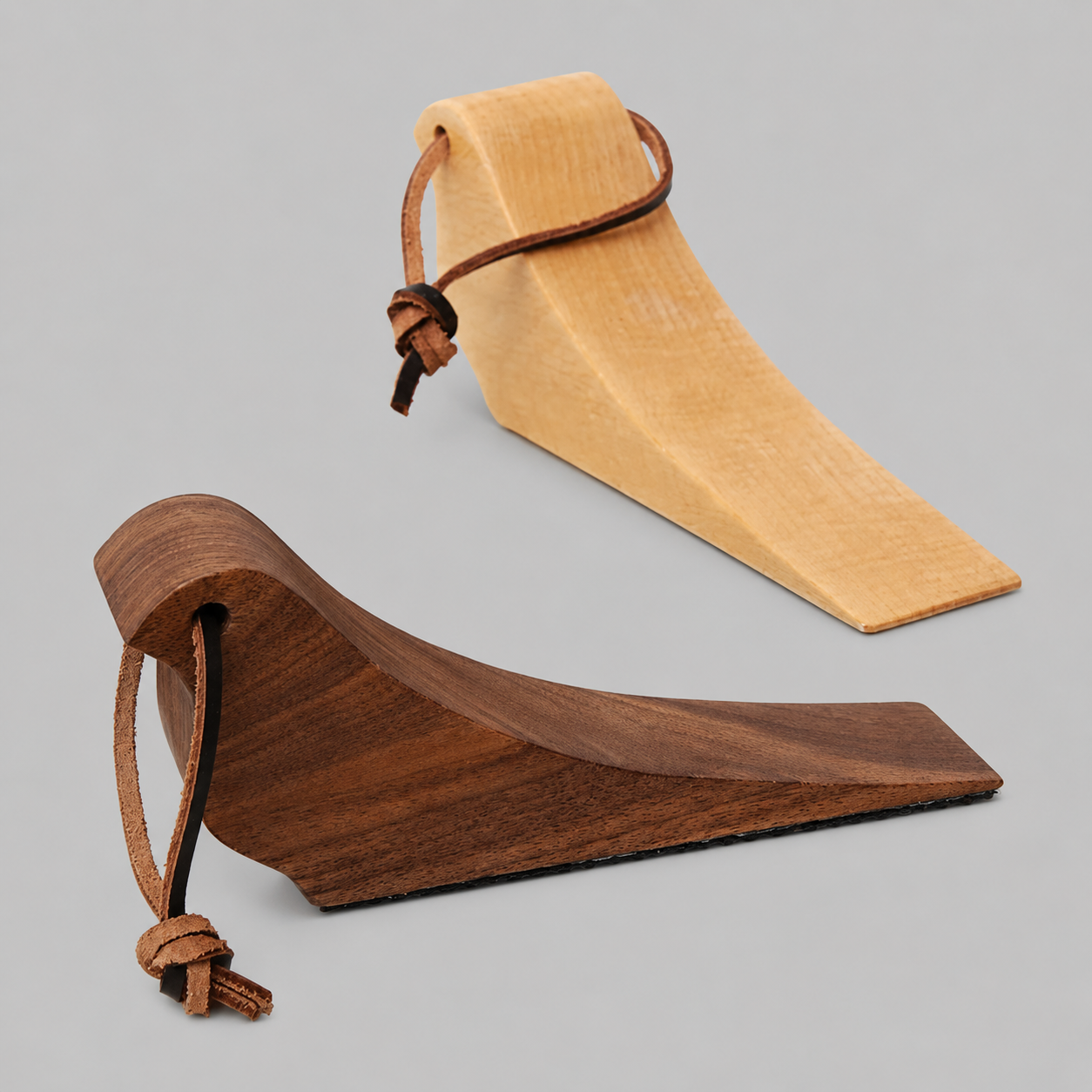 Pair of wooden bird-shaped door stops, walnut and beech finishes