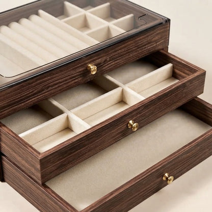 Walnut wooden jewellery box interior with padded dividers, open drawer, and brass hardware