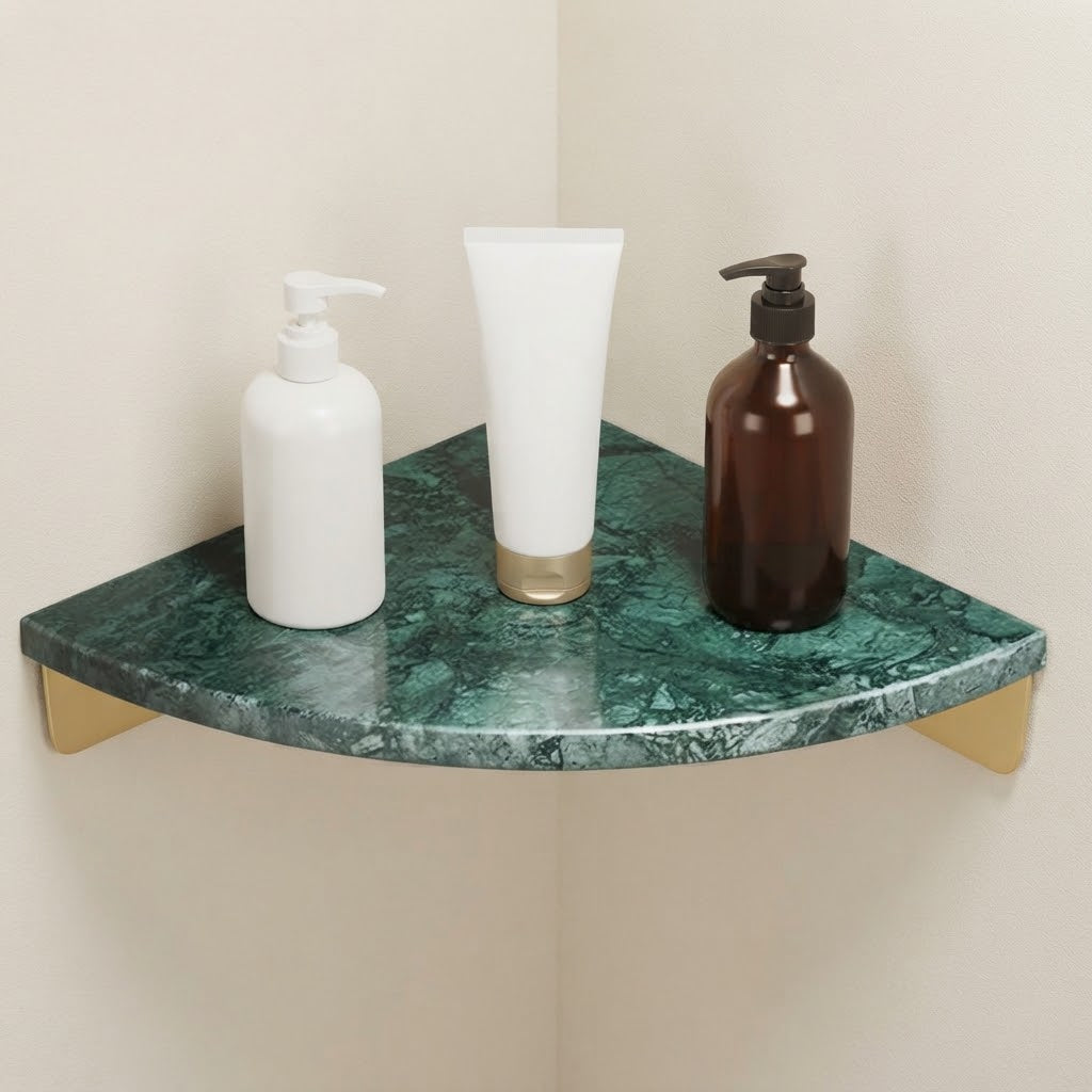 Green marble corner floating shelf with gold supports, three bottles and tube display