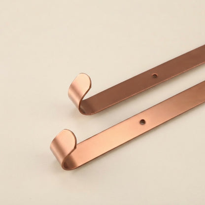 Rose gold wall shower caddy hooks and support bar, curved end design.