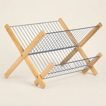 Folding bamboo dish drying rack with two wire shelves and X-stand base