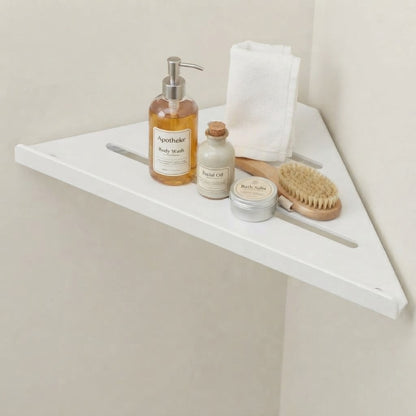White stainless steel slatted corner shelf with three bar openings.