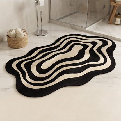 Black and beige wavy ripple diatomite-style non-slip bath mat near shower