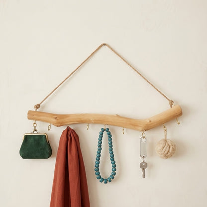 Rustic driftwood hook rail with rope hanger and loop hooks with purse, beads, and keys