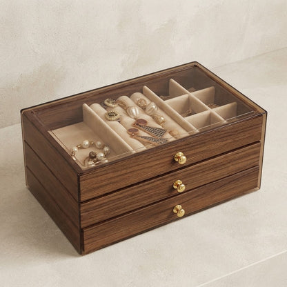 Walnut wooden jewellery box with clear lid and padded insert trays for rings, necklaces, and earrings