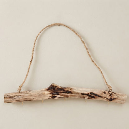 Rustic driftwood multi-hook rail with rope hanger and small metal hooks on branch wood