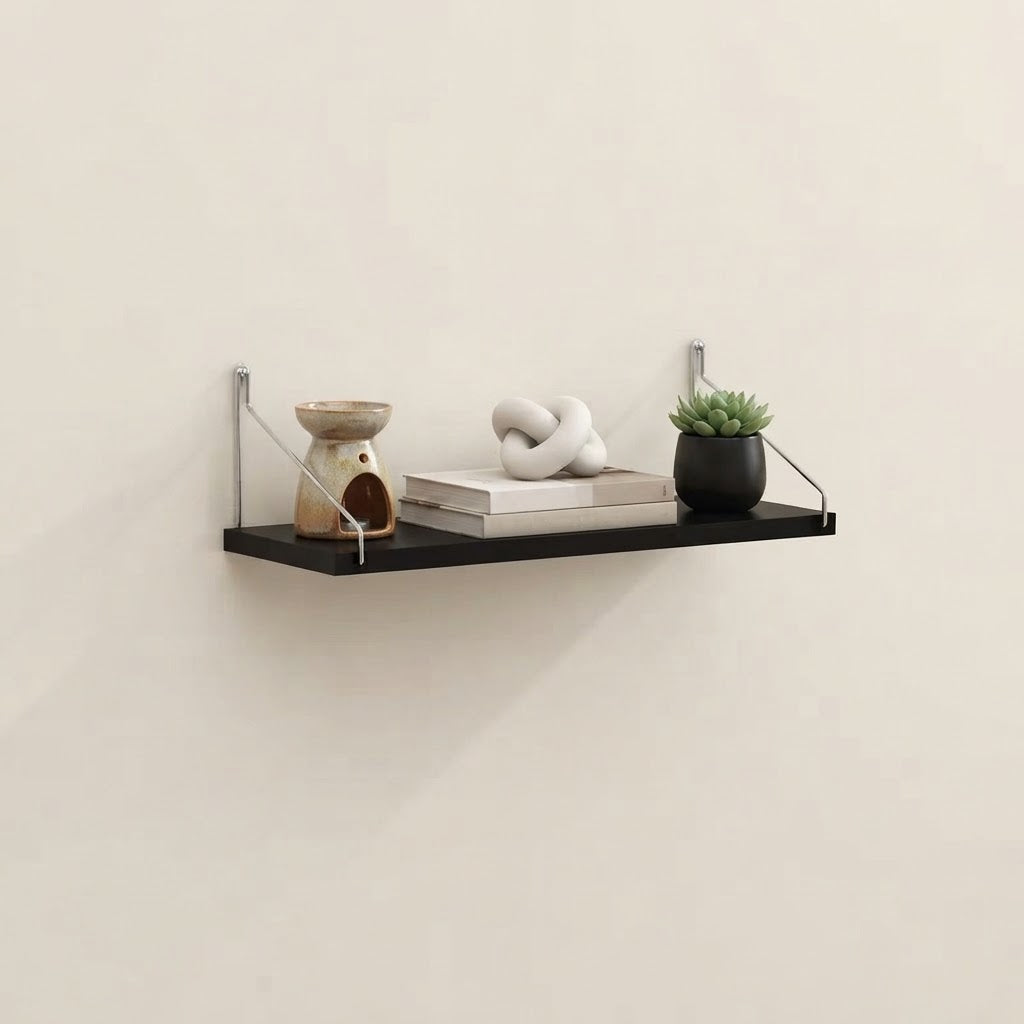 Bracket-mounted floating wall shelf with black shelf, metal brackets, and open frame ends