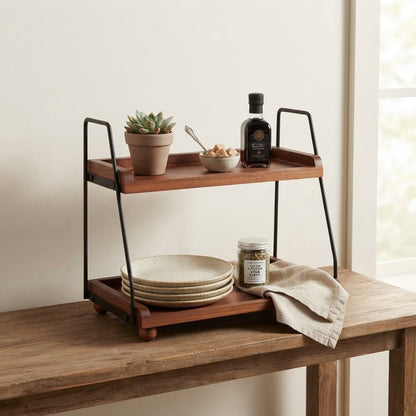 Two-tier kitchen rack with dark wooden shelves and black metal frame on countertop