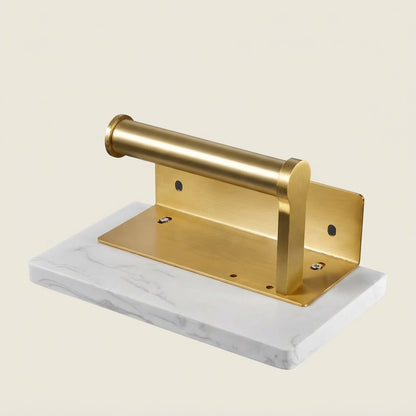 Brushed gold mounting base with cylindrical holder on marble-look white block