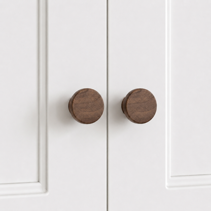 Dark wood flared drawer knobs, round face on short pedestal, two shown