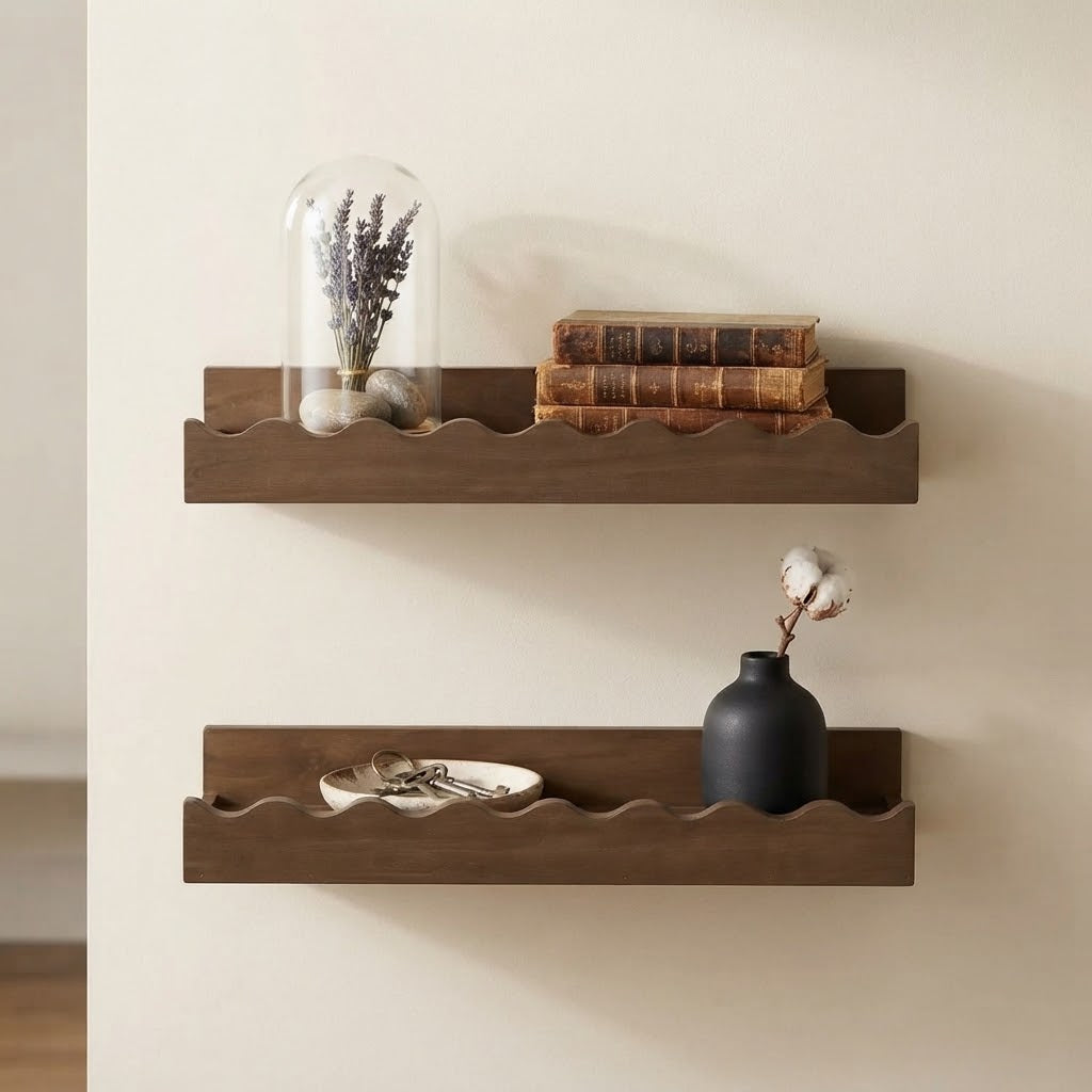 Walnut wooden floating wall shelves with scalloped edges, styled with decor items