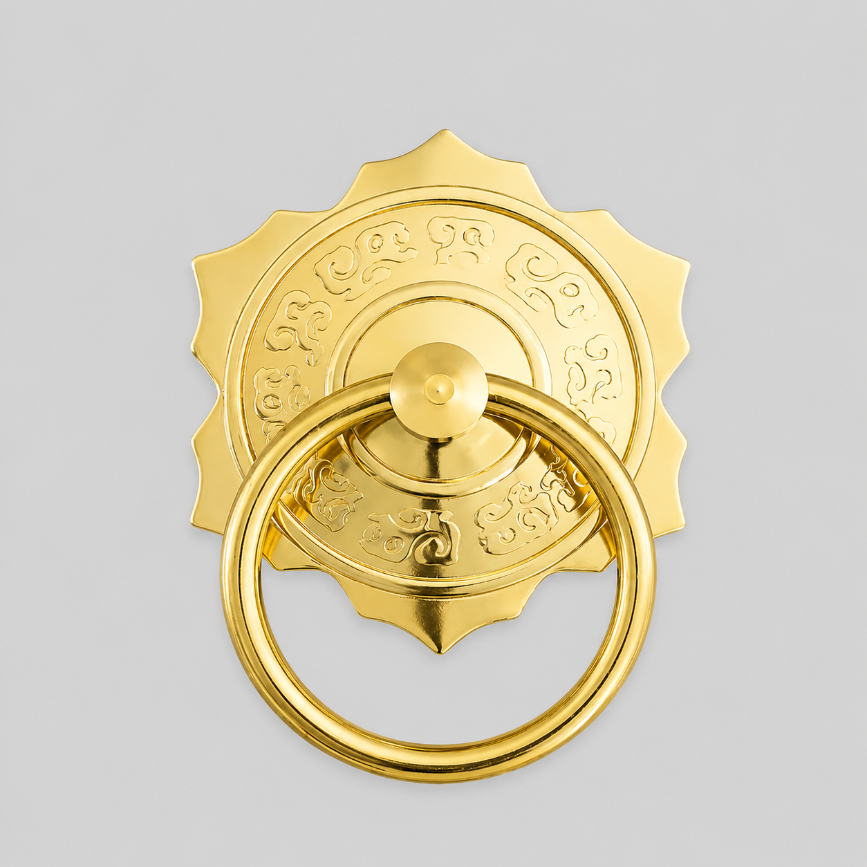 Gold brass pull ring door knocker with ornate rosette and round strike plate