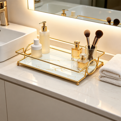 Gold vanity tray with marble-effect insert on bathroom counter, with towel and cosmetics
