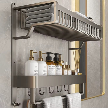 Wall-mounted aluminum bathroom shelf with towel bar, bottle ledge, and hanging hooks