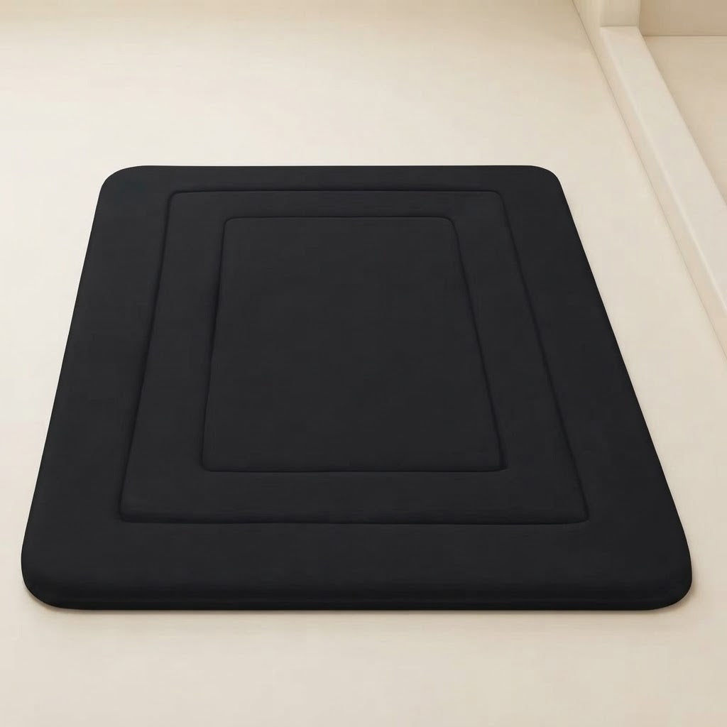 Black soft cushioned non-slip bath mat with recessed square design