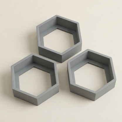 Grey hexagon floating wall shelves, three open hexagon frames