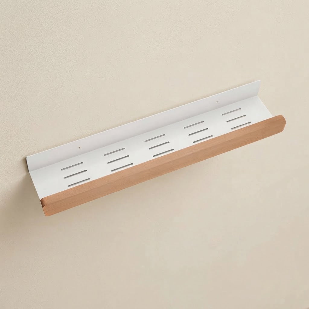 Wall-mounted storage shelf with white slotted back and light beech wood front rail