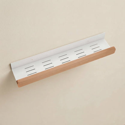 Wall-mounted storage shelf with white slotted back and light beech wood front rail
