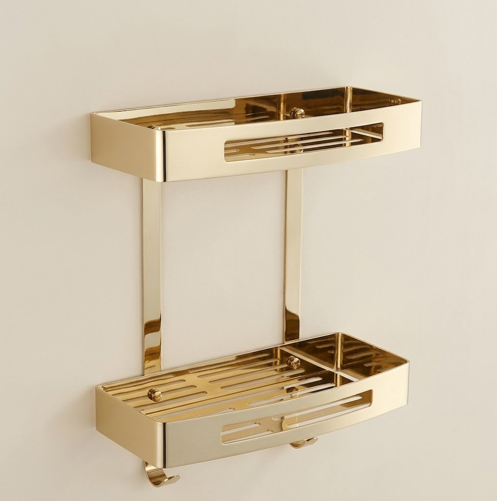 Gold stainless steel wall shower caddy with two stacked trays and hanging hooks.