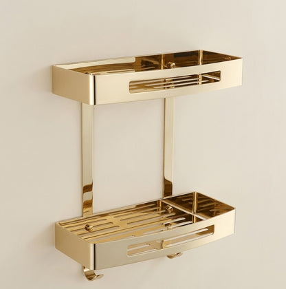 Gold stainless steel wall shower caddy with two stacked trays and hanging hooks.