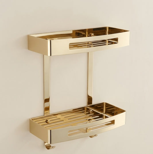 Gold stainless steel wall shower caddy with two stacked trays and hanging hooks.