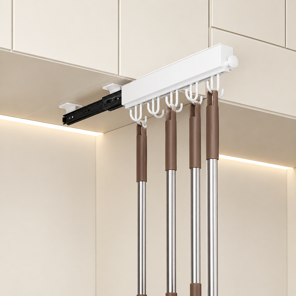 White sliding hook rail with pull-out rods and curved hooks under a cabinet