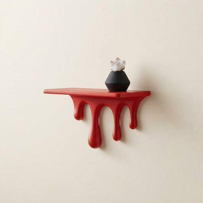 Red floating wall shelf with dripping legs and smooth flat top edge