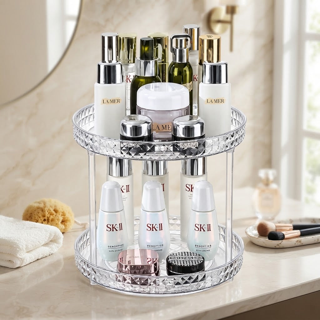 Rotating makeup organizer with two stacked clear tiers and mirrored diamond-pattern edge