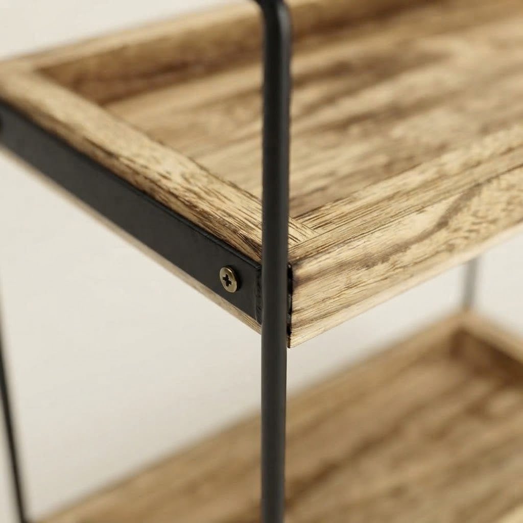 Close-up of black metal corner bracket with screw on wooden shelf rack