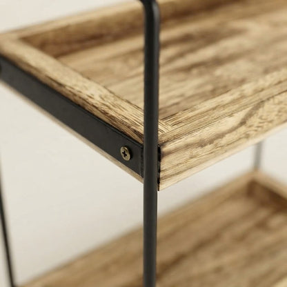 Close-up of black metal corner bracket with screw on wooden shelf rack