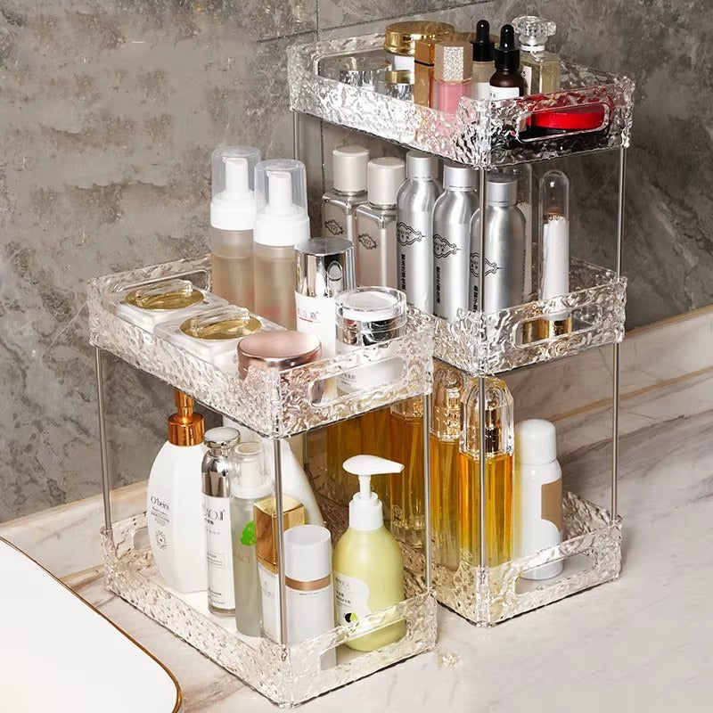 Two-tier vanity makeup organizer with clear faceted frame and open shelves